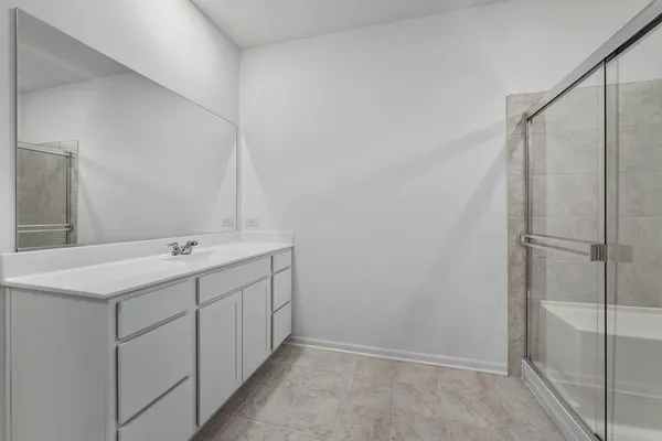 a bathroom with a double vanity sink and mirror