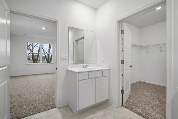a bathroom with a sink and mirror