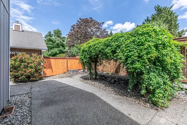 a backyard of a house with lots of green space