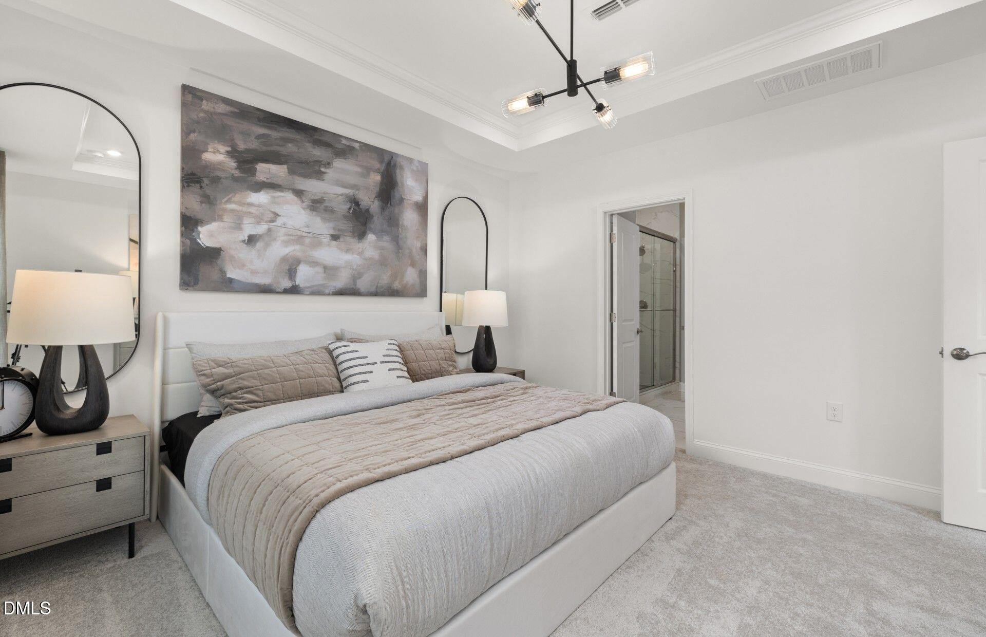 141 Omaha Way Clayton, NC 27520 - Photo 8 of 40 a bedroom with a bed and a painting on the wall