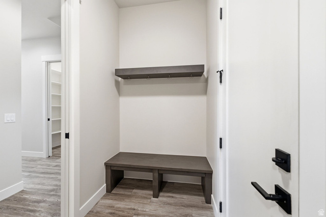 496 North Farmhouse Way, Unit 11 Midway, UT 84049 - Photo 44 of 50 Entryway mudroom featuring a built-in bench, integrated wall shelf with hooks, and wood-finish flooring