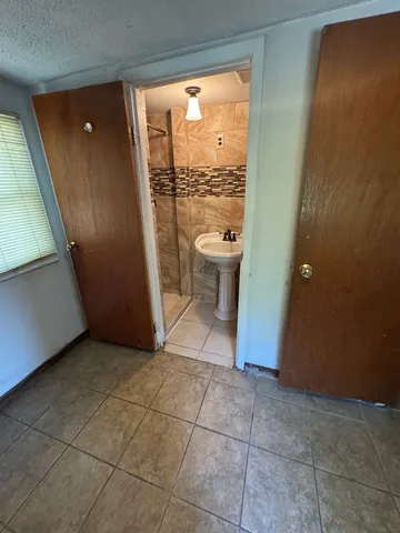 a view of a bathroom with a sink and a vanity