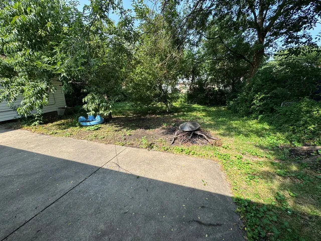 a view of backyard of a house