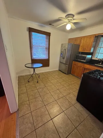 a living room with couches and projector with a rug