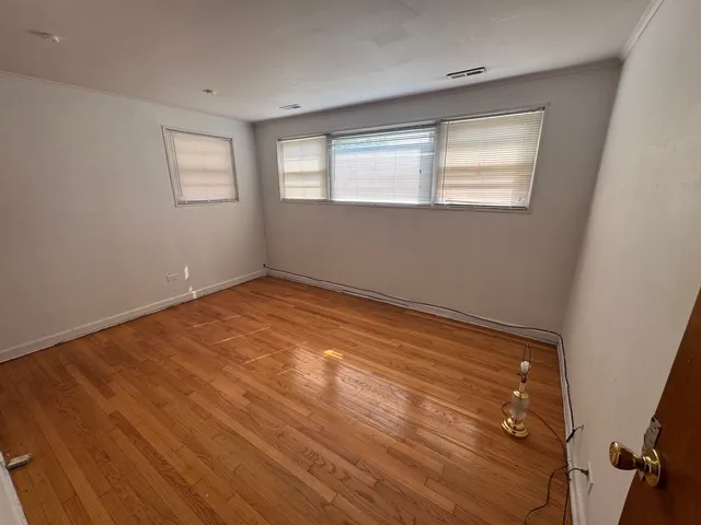 a view of empty room with windows