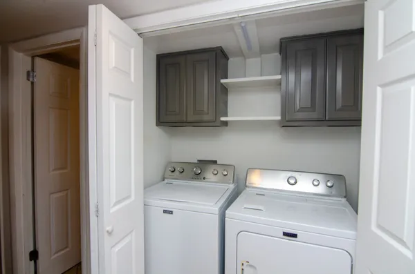 a utility room with dryer and washer