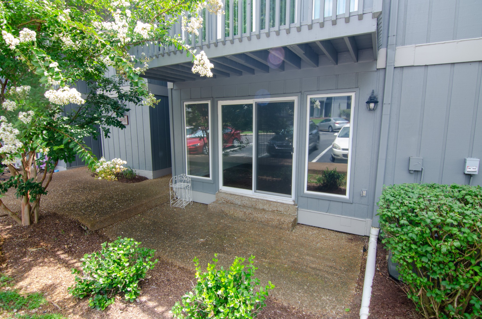 21 Vaughns Gap Road, Unit 110 Nashville, TN 37205 - Photo 18 of 19 a front view of a house with a yard and potted plants