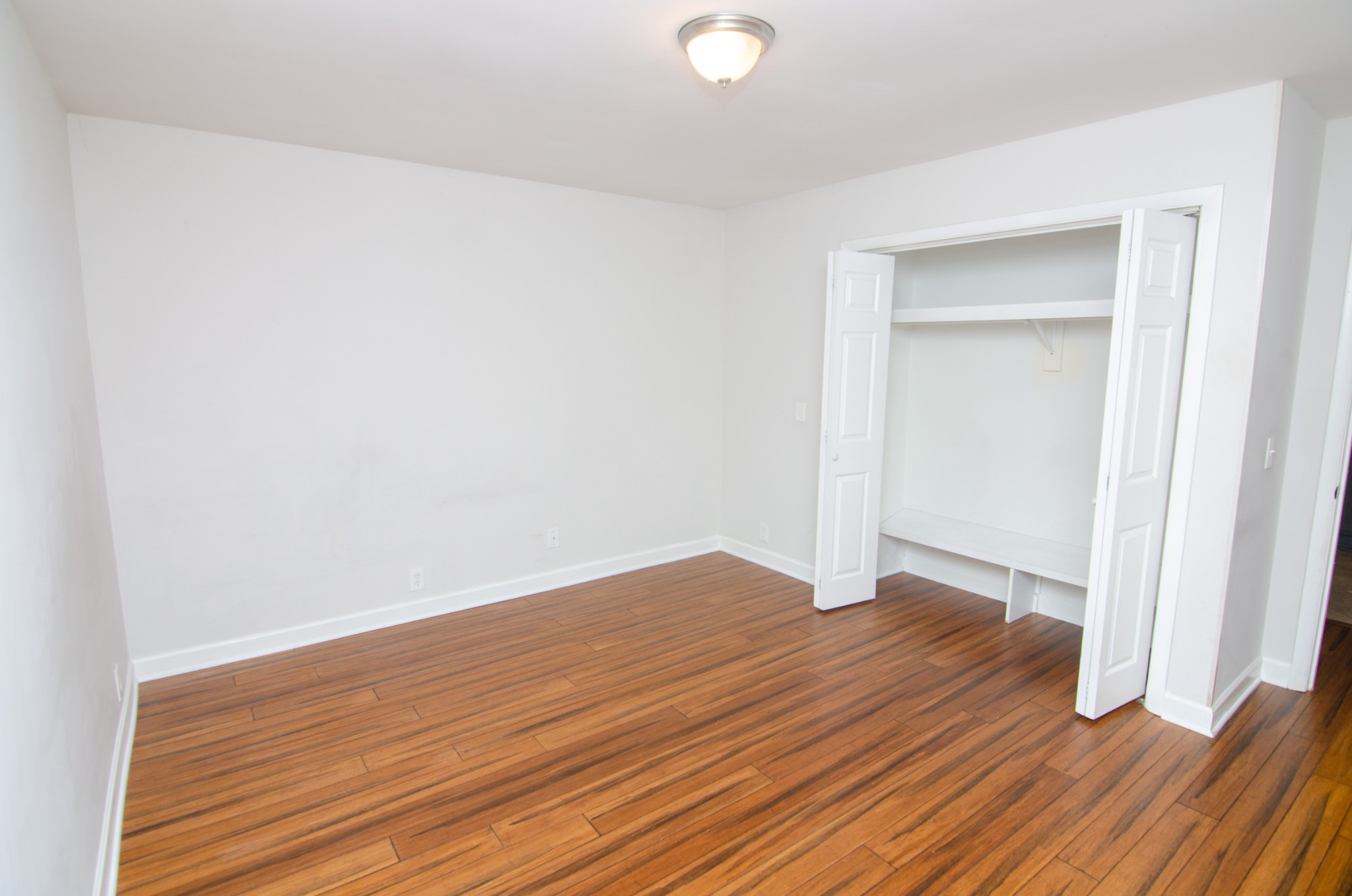 21 Vaughns Gap Road, Unit 110 Nashville, TN 37205 - Photo 9 of 19 a view of empty room with wooden floor