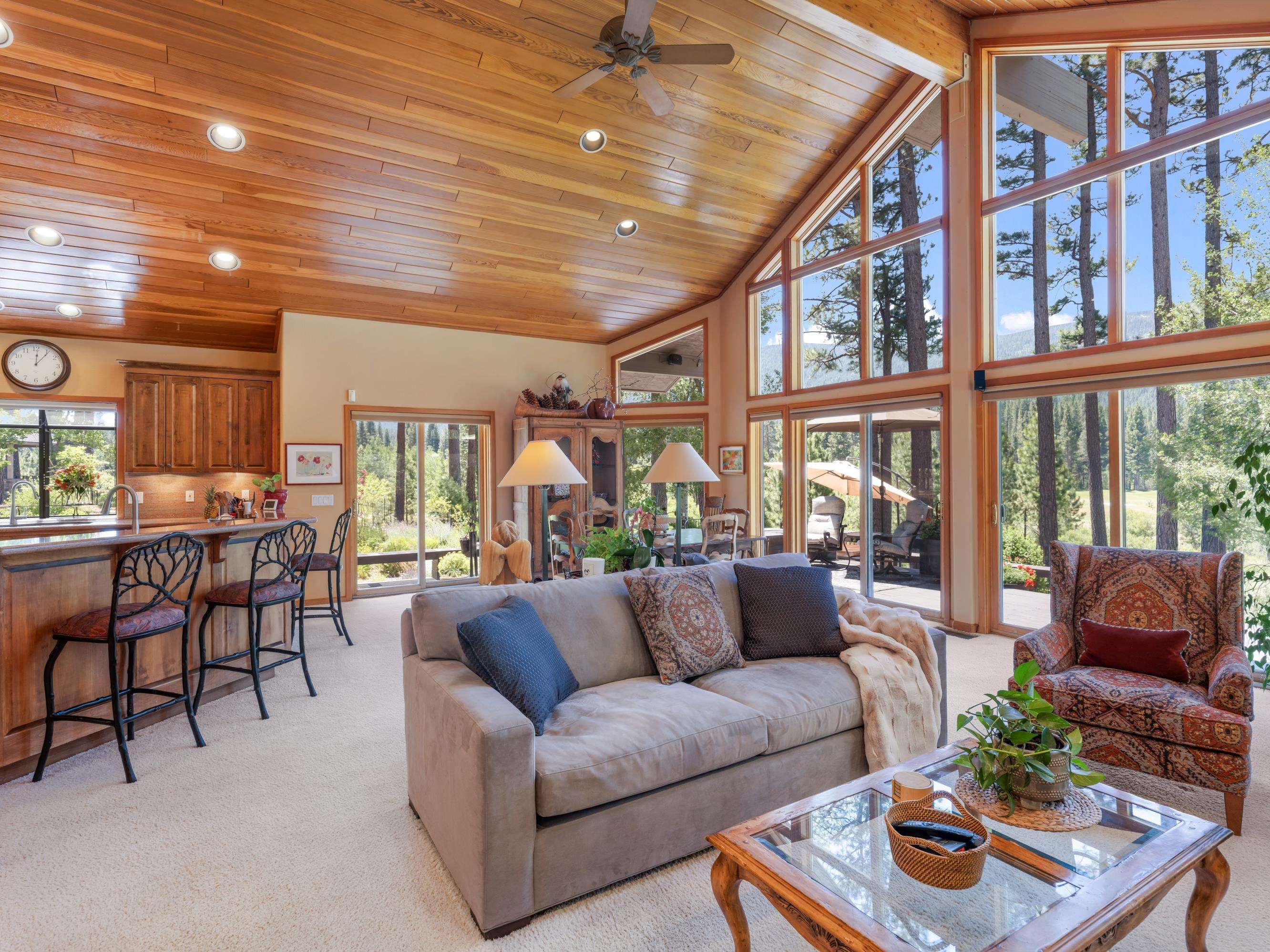 134 Quail View Circle Clio, CA 96106 - Photo 10 of 49 a living room with furniture and a floor to ceiling window