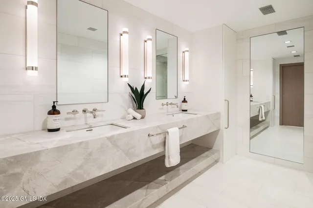 a view of a kitchen with a table and chairs