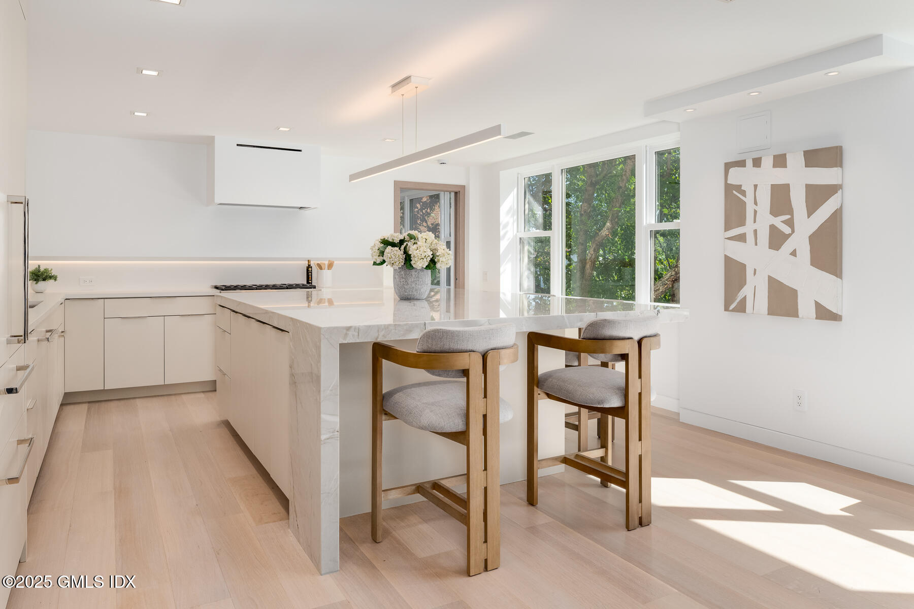 636 Steamboat Road, Unit 3A B & E Greenwich, CT 06830 - Photo 15 of 28 a view of a kitchen with a table and chairs