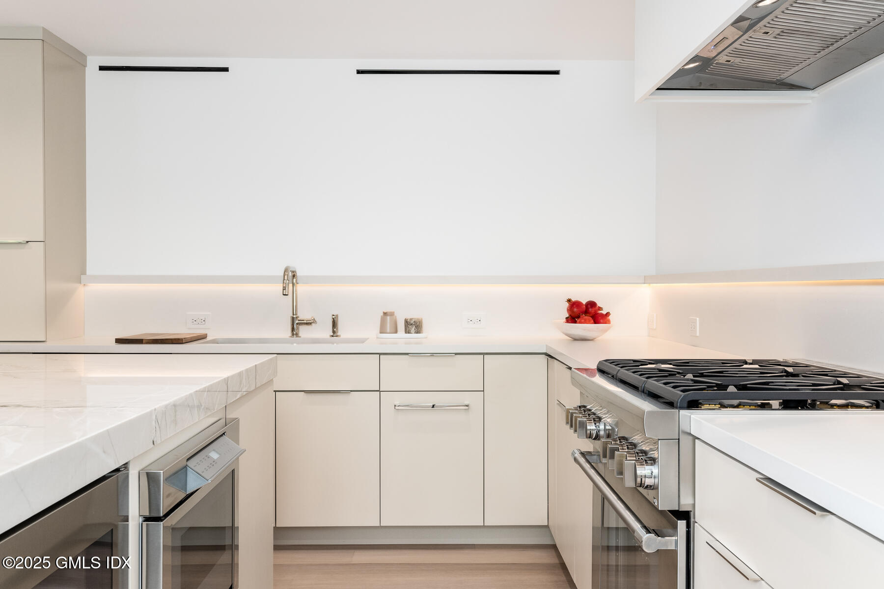 636 Steamboat Road, Unit 3A B & E Greenwich, CT 06830 - Photo 16 of 28 a kitchen with white cabinets and white appliances