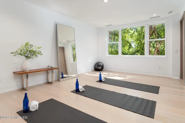 a bathroom with a granite countertop shower sink and mirror