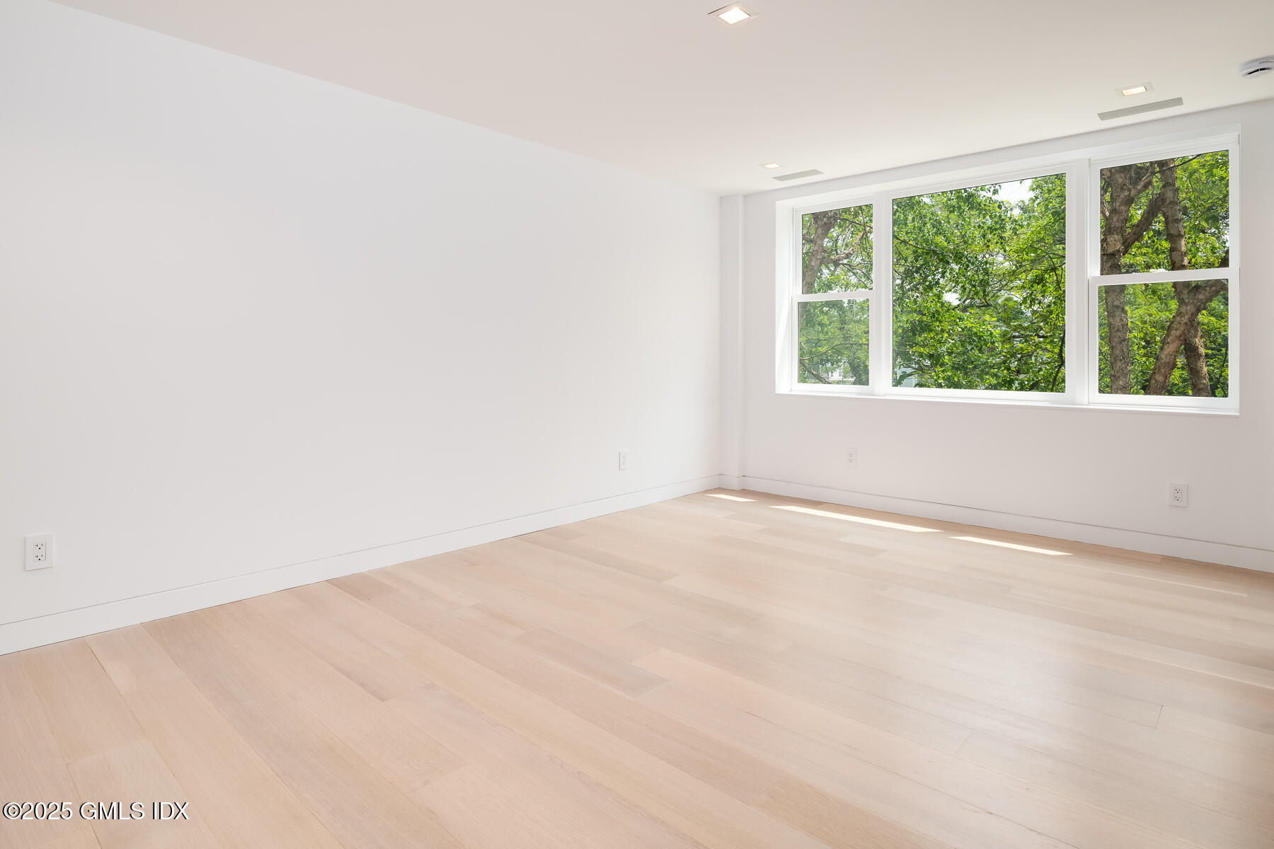 636 Steamboat Road, Unit 3A B & E Greenwich, CT 06830 - Photo 19 of 28 an empty room with large windows