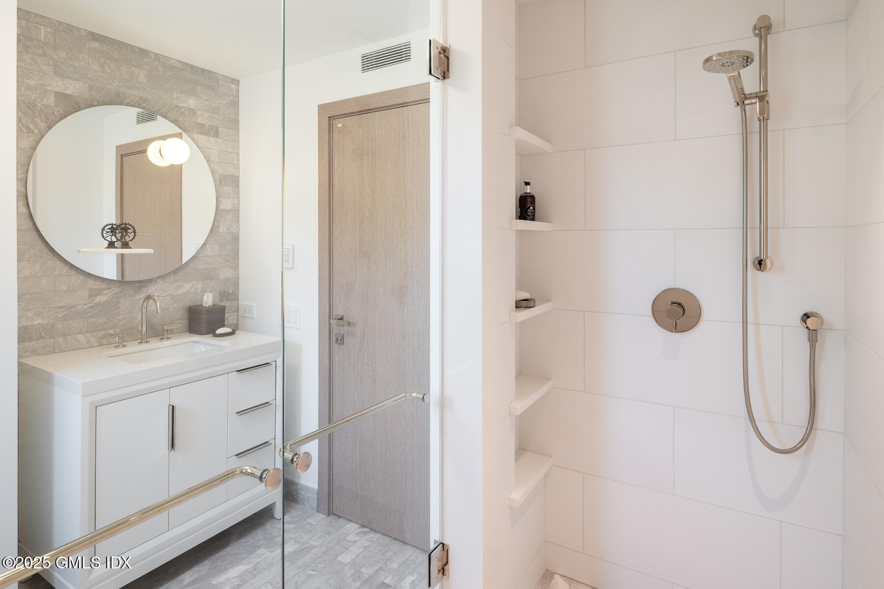 636 Steamboat Road, Unit 3A B & E Greenwich, CT 06830 - Photo 20 of 28 a bathroom with a granite countertop shower sink and mirror