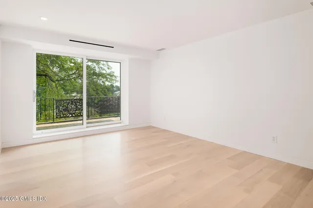 an aerial view of a house with a lake view