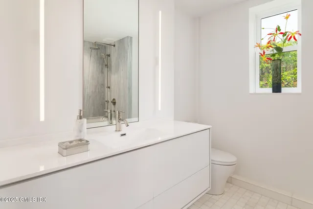 a view of a lake with sitting area