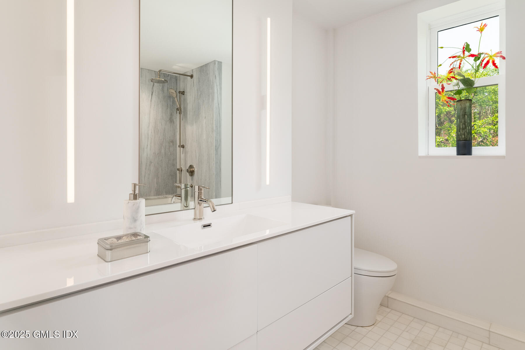 636 Steamboat Road, Unit 3A B & E Greenwich, CT 06830 - Photo 22 of 28 a bathroom with a sink a toilet and a mirror