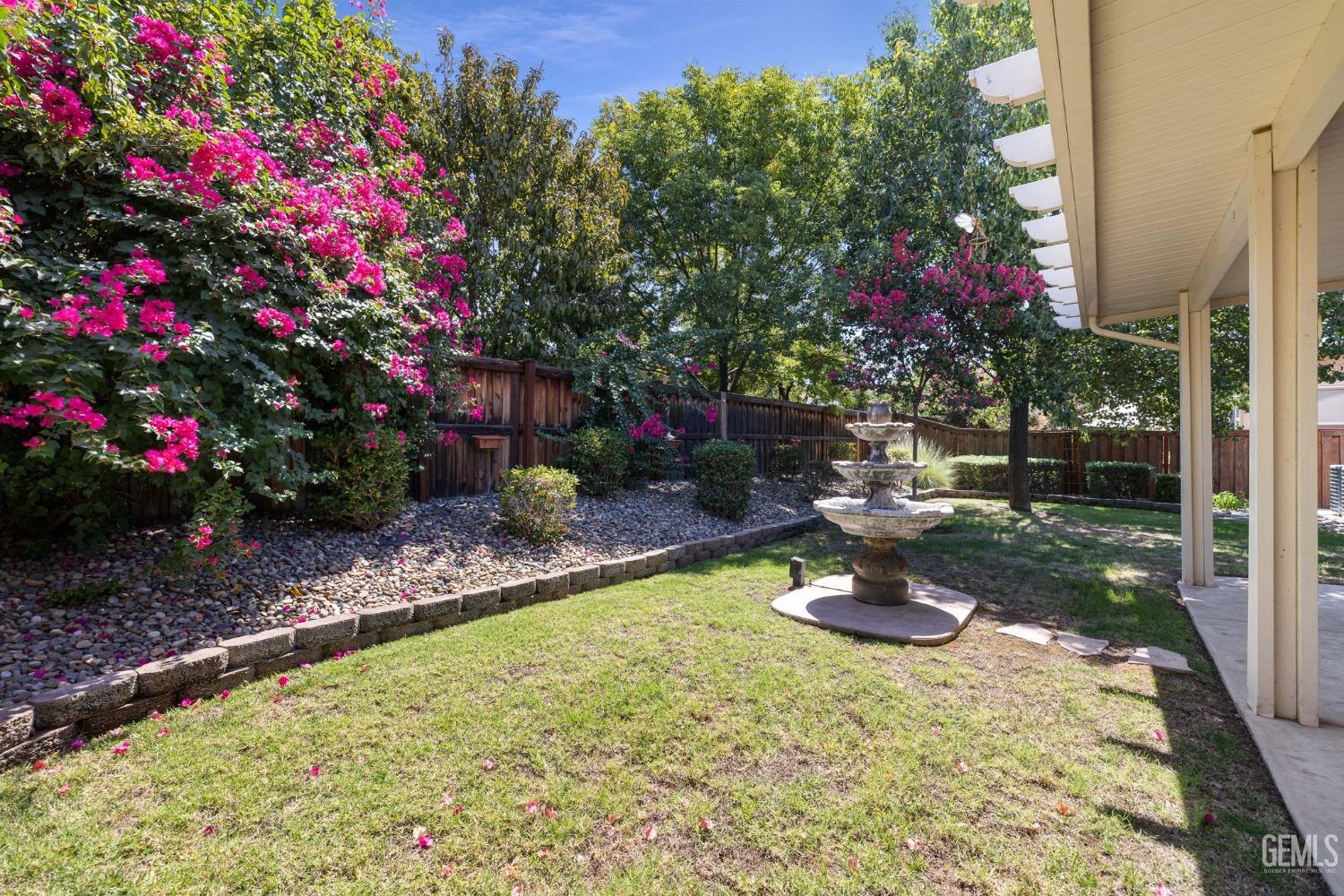 Undisclosed Address Bakersfield, CA 93306 - Photo 23 of 36 a small garden covered with tall trees