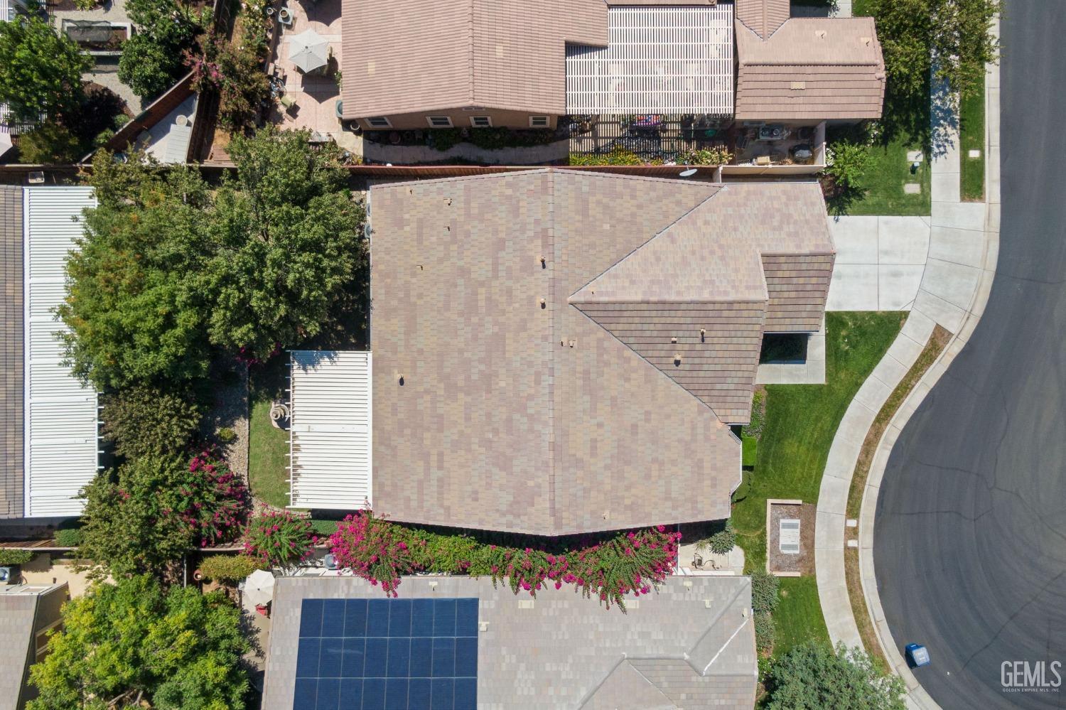 Undisclosed Address Bakersfield, CA 93306 - Photo 27 of 36 an aerial view of a house with garden space and street view