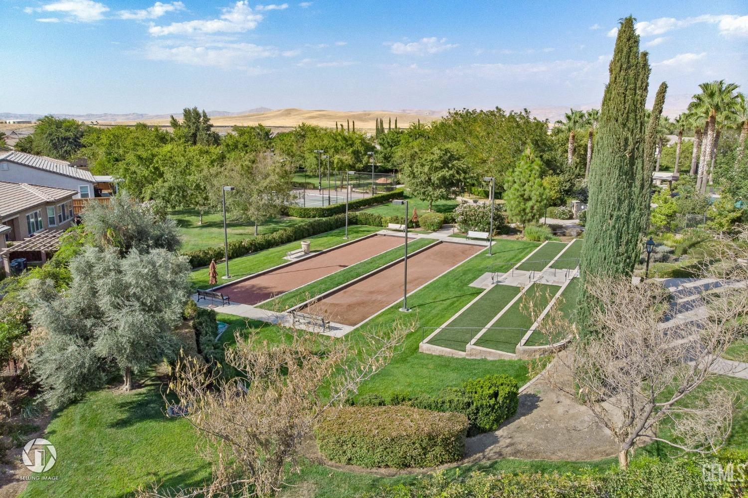 Undisclosed Address Bakersfield, CA 93306 - Photo 33 of 36 a view of a tennis ground with a large pool