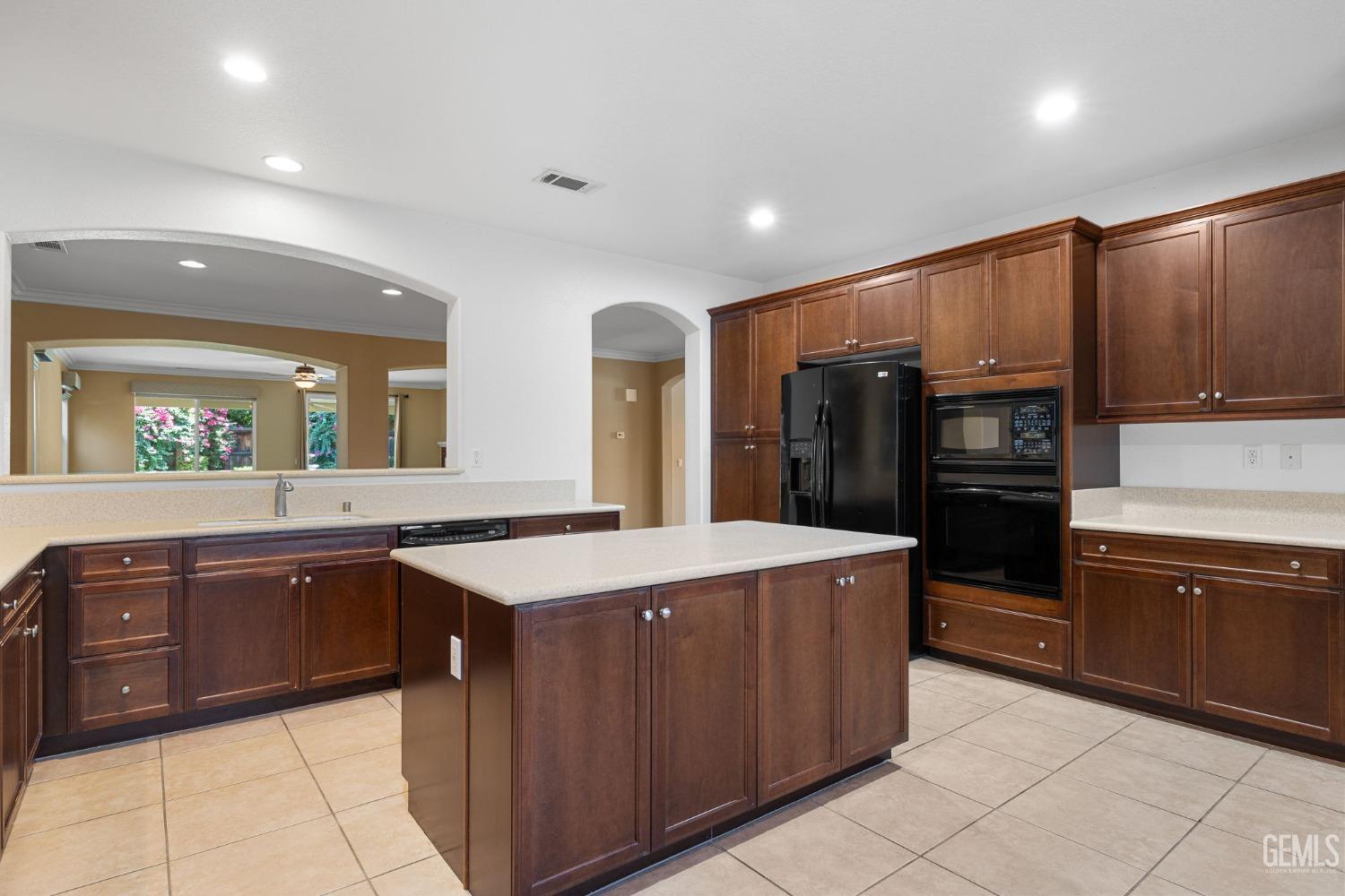 Undisclosed Address Bakersfield, CA 93306 - Photo 8 of 36 a kitchen with stainless steel appliances granite countertop a stove and a refrigerator