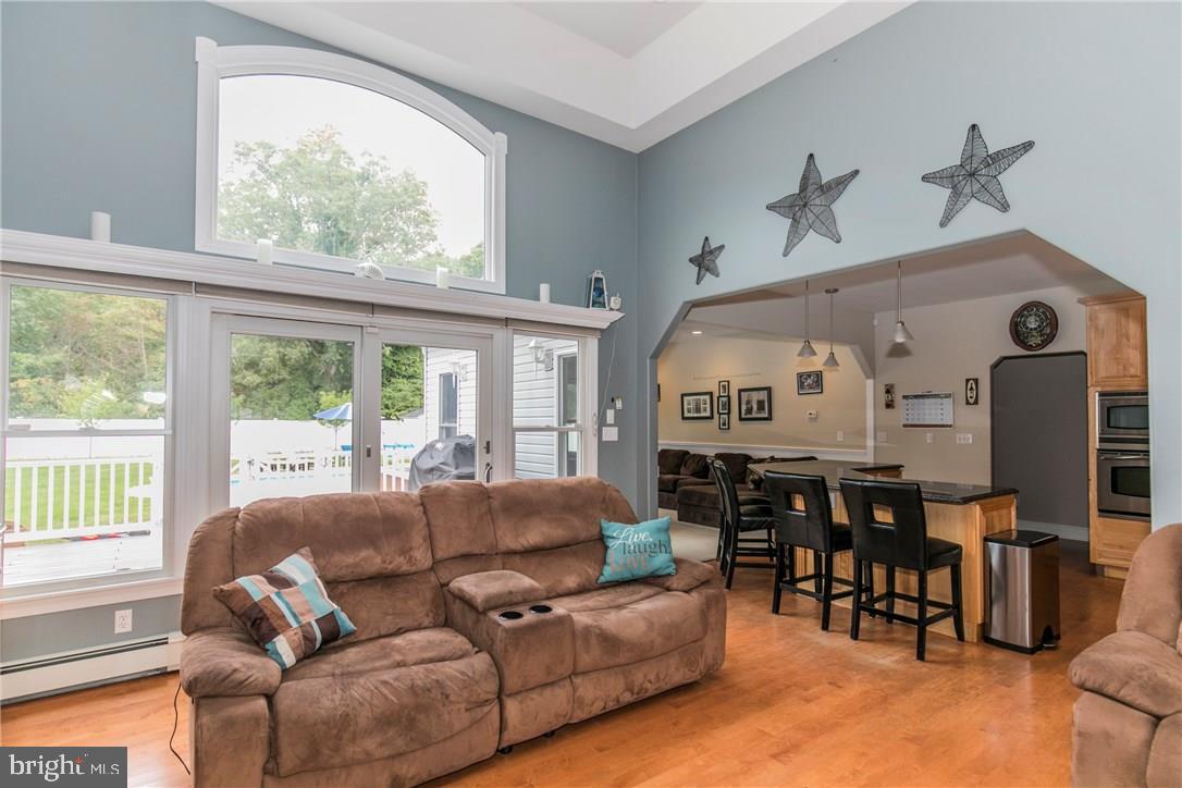 39 Harbor Inn Road Bayville, NJ 08721 - Photo 14 of 27 a living room with furniture and large windows