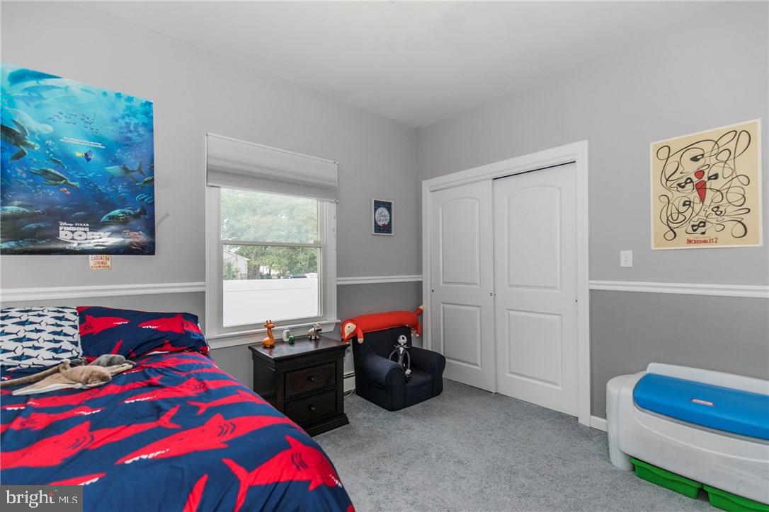39 Harbor Inn Road Bayville, NJ 08721 - Photo 15 of 27 a bedroom with a bed and a window