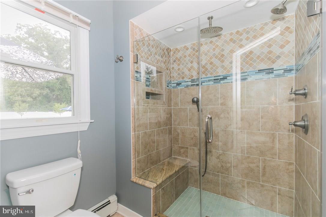 39 Harbor Inn Road Bayville, NJ 08721 - Photo 19 of 27 a bathroom with a shower and toilet