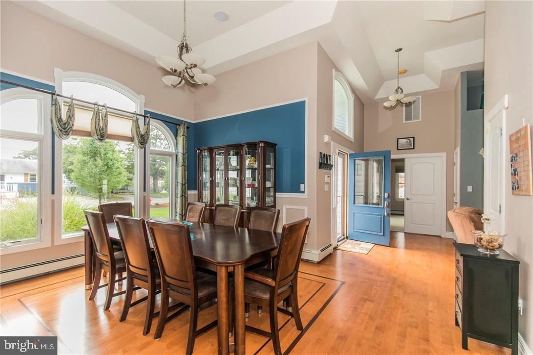 39 Harbor Inn Road Bayville, NJ 08721 - Photo 3 of 27 a view of a dining room with furniture window and wooden floor