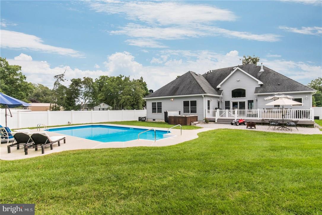 39 Harbor Inn Road Bayville, NJ 08721 - Photo 23 of 27 a view of a house with swimming pool and porch