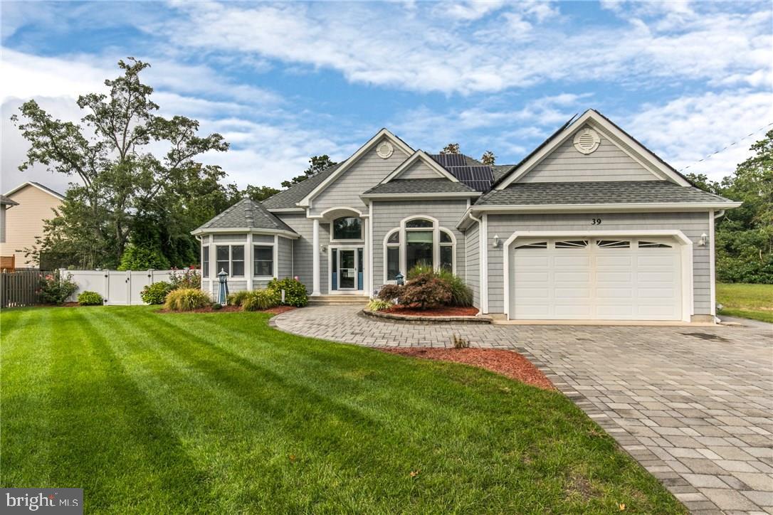 39 Harbor Inn Road Bayville, NJ 08721 - Photo 27 of 27 a front view of a house with a yard and trees