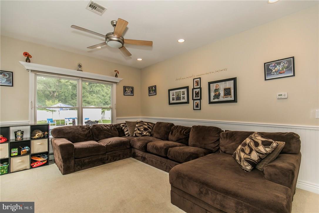 39 Harbor Inn Road Bayville, NJ 08721 - Photo 4 of 27 a living room with furniture and a large window