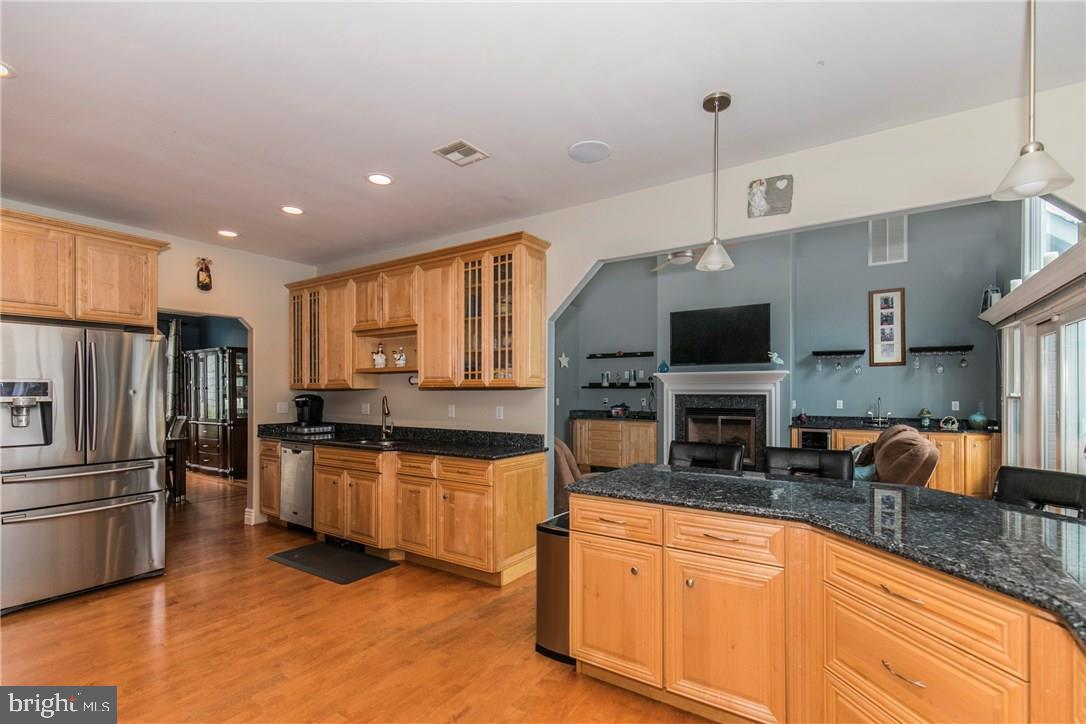 39 Harbor Inn Road Bayville, NJ 08721 - Photo 9 of 27 a kitchen with stainless steel appliances granite countertop a sink refrigerator and microwave