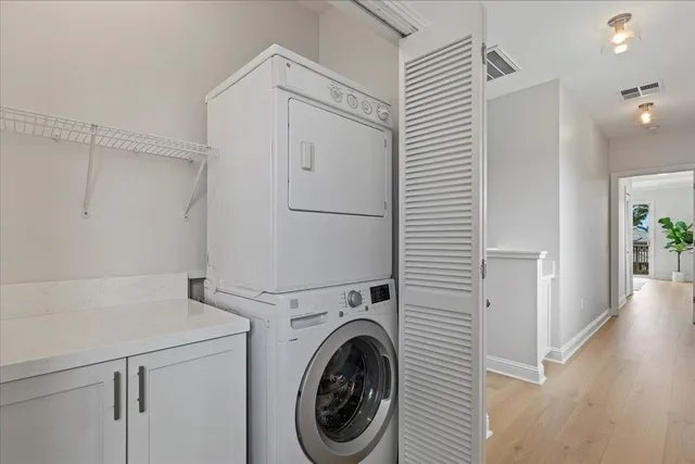 a view of a hallway with washer and dryer