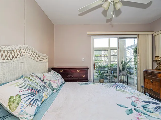 a bedroom with a bed and a television