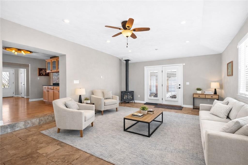 1238 Georges Station Road Greensburg, PA 15601 - Photo 18 of 50 Family room offers higher ceilings with ceramic tile and gas stove.