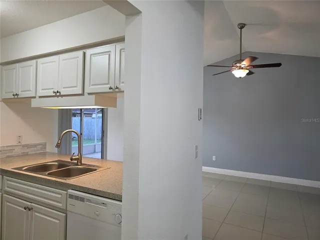 a kitchen with a sink and cabinets