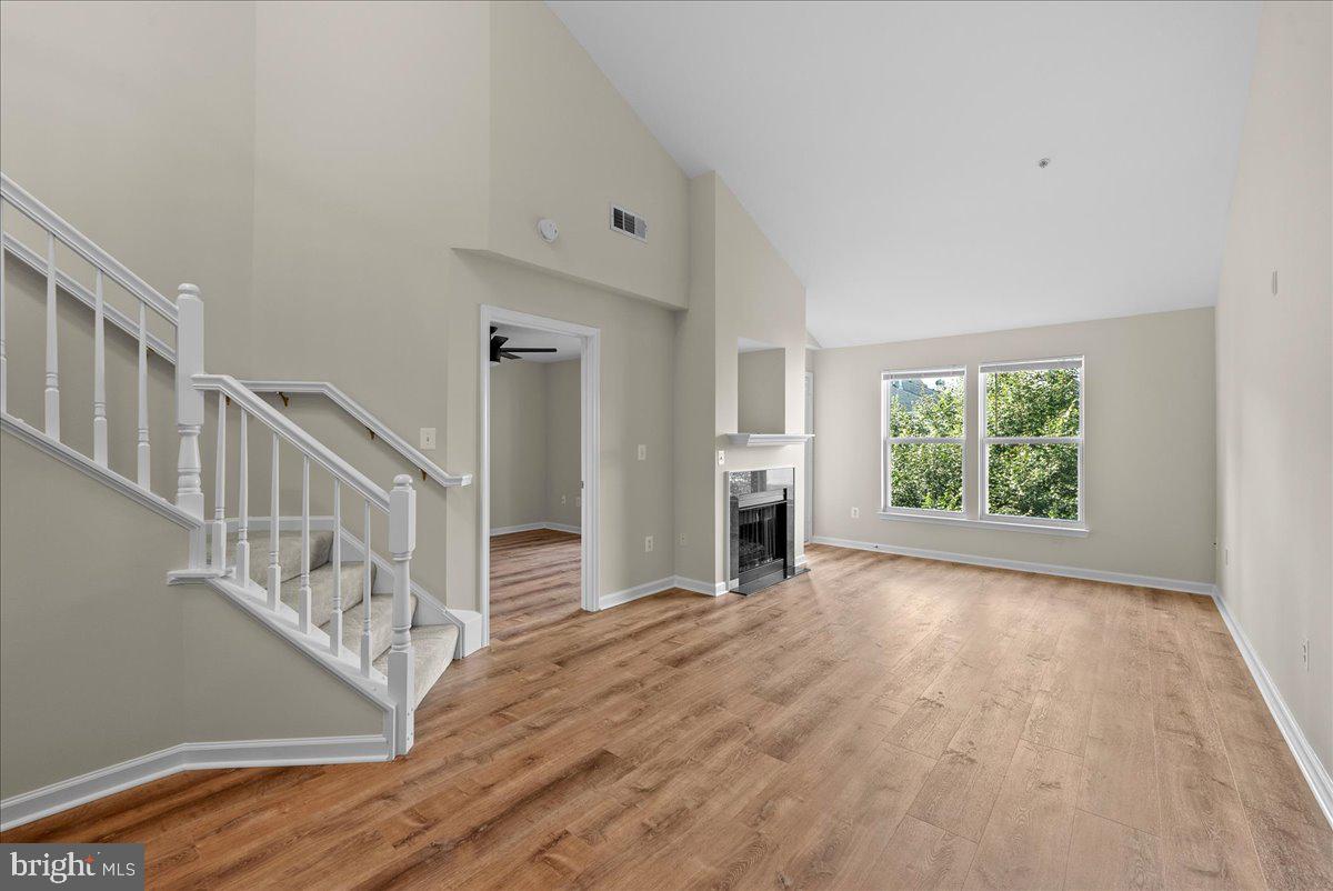 12000 Market Street, Unit 469 Reston, VA 20190 - Photo 1 of 41 a view of empty room with wooden floor and fan