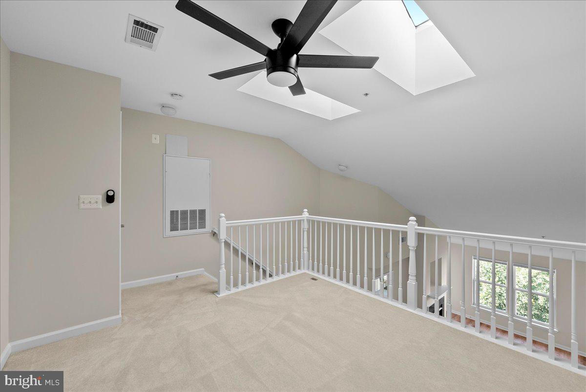 12000 Market Street, Unit 469 Reston, VA 20190 - Photo 18 of 41 a view of a hallway with a ceiling fan