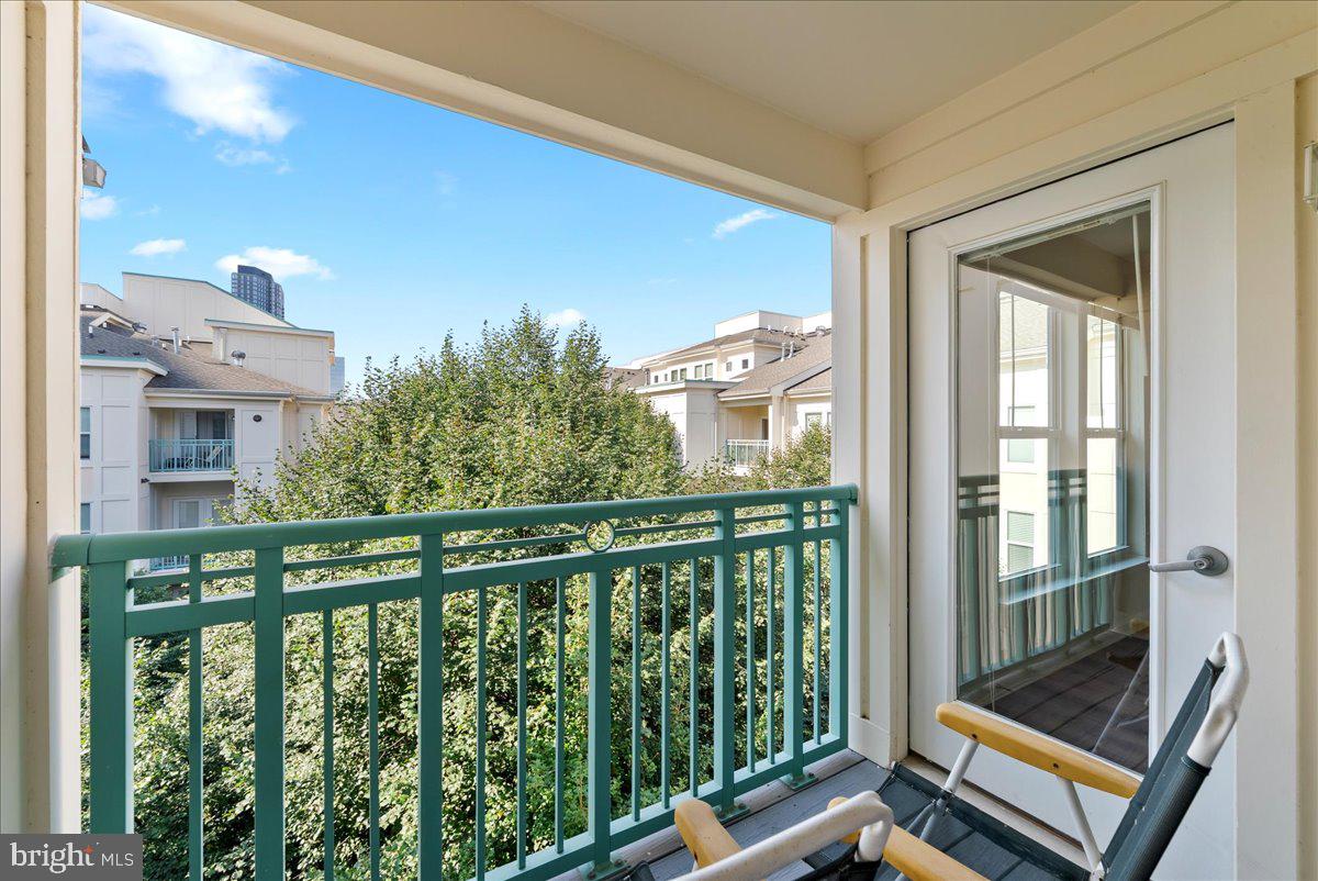 12000 Market Street, Unit 469 Reston, VA 20190 - Photo 22 of 41 a view of a balcony with furniture