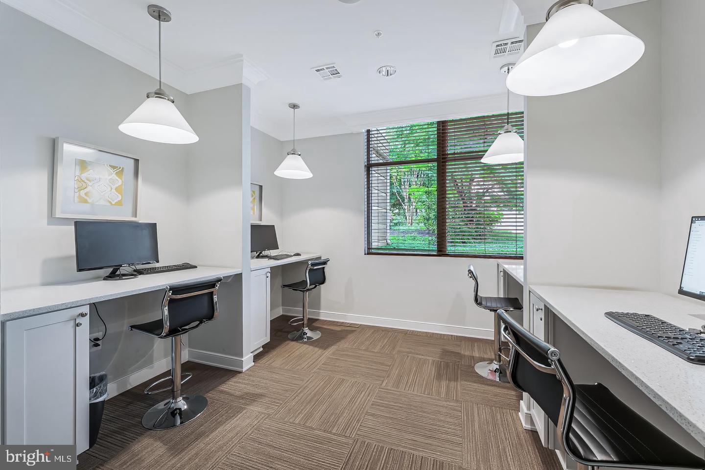 12000 Market Street, Unit 469 Reston, VA 20190 - Photo 31 of 41 a view of a workspace with furniture and a window