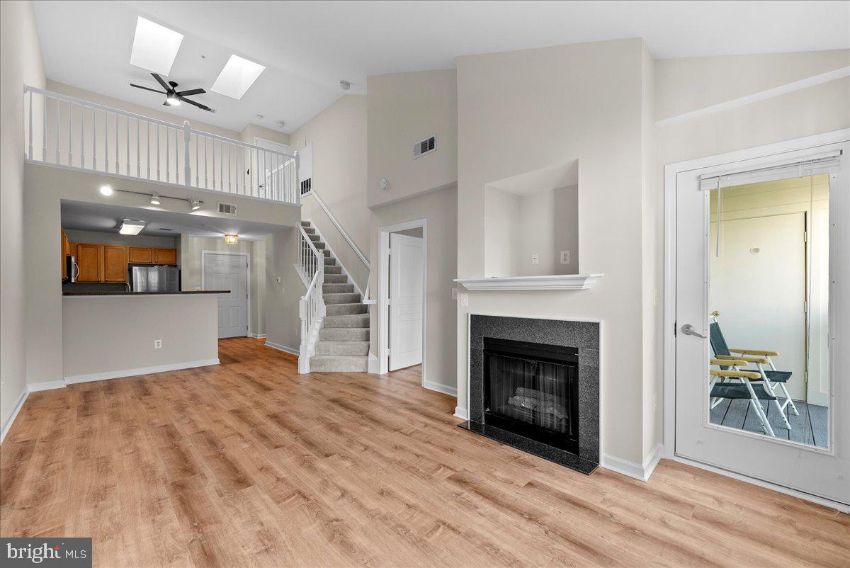 12000 Market Street, Unit 469 Reston, VA 20190 - Photo 4 of 41 a view of a livingroom with a fireplace