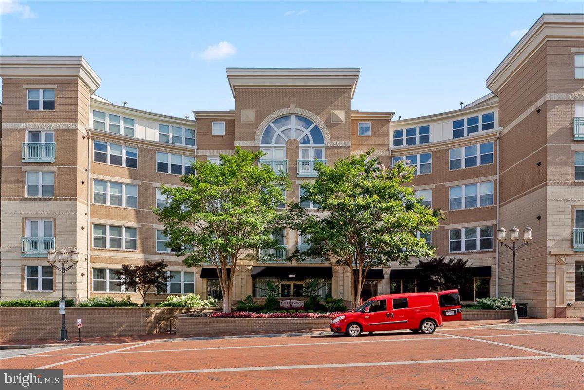 12000 Market Street, Unit 469 Reston, VA 20190 - Photo 41 of 41 a view of a building and car parked on the road