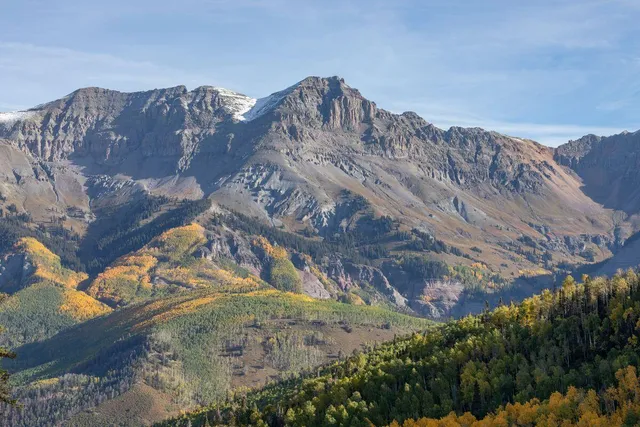 a view of a city with mountains in the background