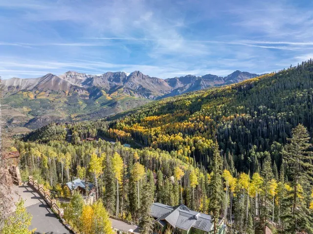 a view of a city with mountains in the background