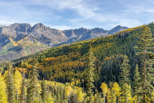 a view of a city with mountains in the background