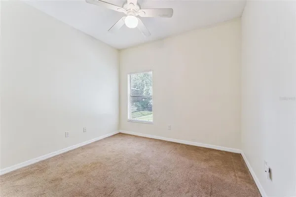 a large bathroom with a large mirror vanity and shower