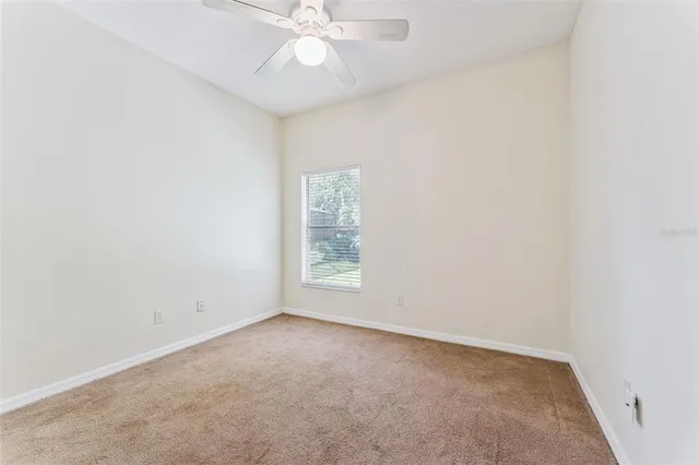 a large bathroom with a large mirror vanity and shower
