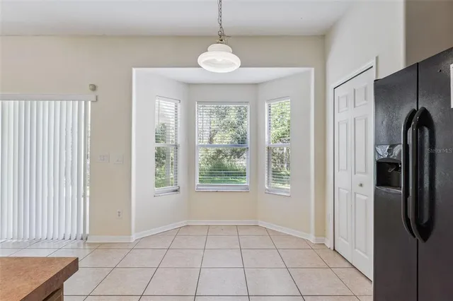 a view of a kitchen with a sink and a window